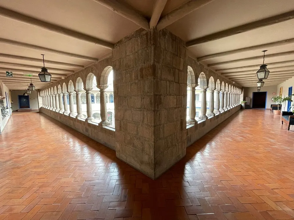 Historic stone hallways and arches at Palacio del Inka